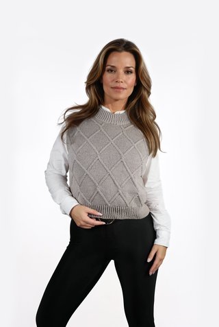 Vest with braid detail knitted from Grivette Design's knitting pattern no 009