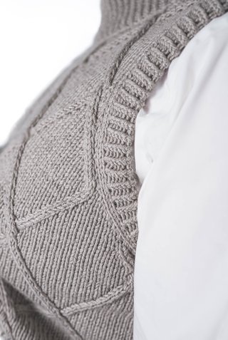 Vest with braid detail knitted from Grivette Design's knitting pattern no 009